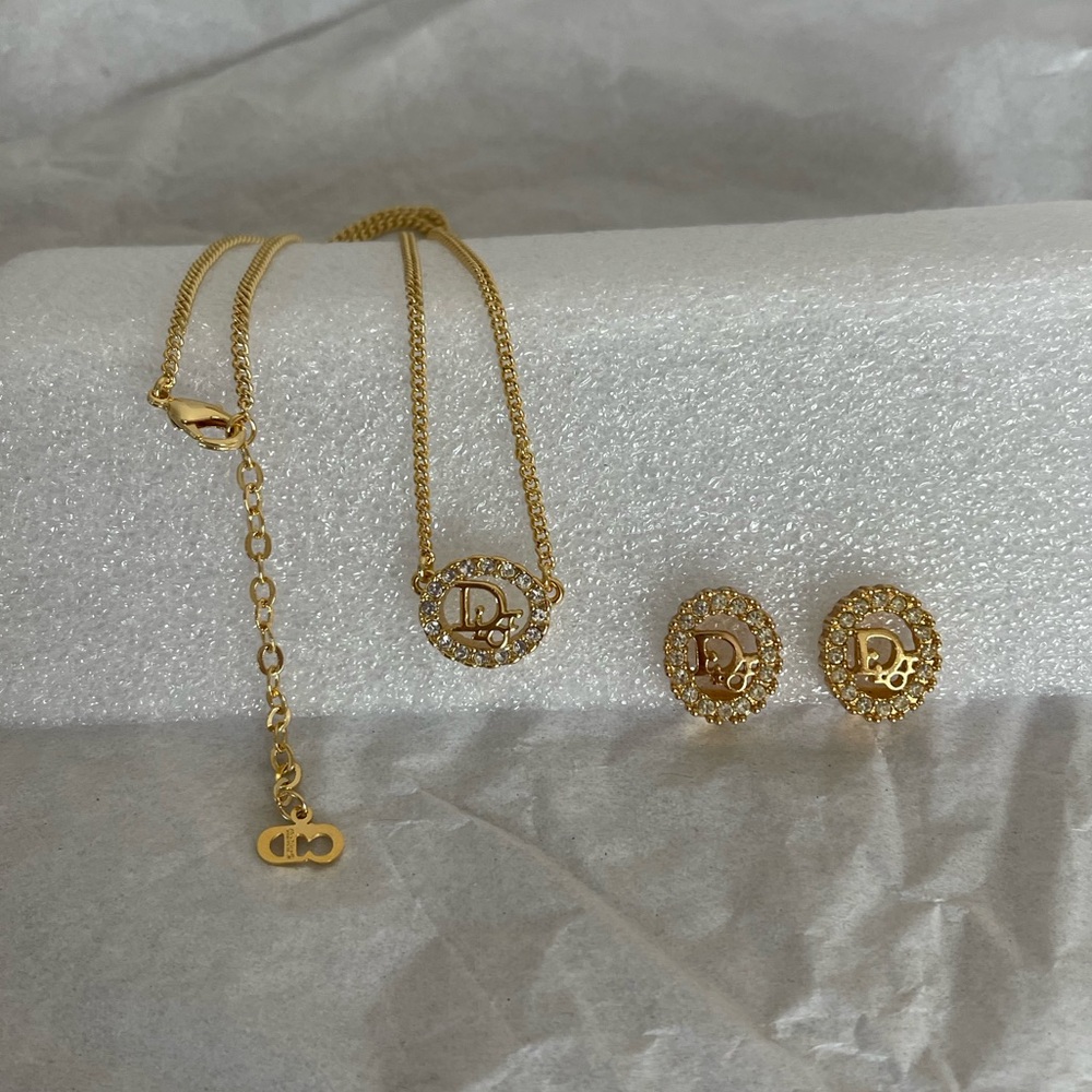 Christian Dior vintage jewelry set necklace + earrings gold crystals logo crest